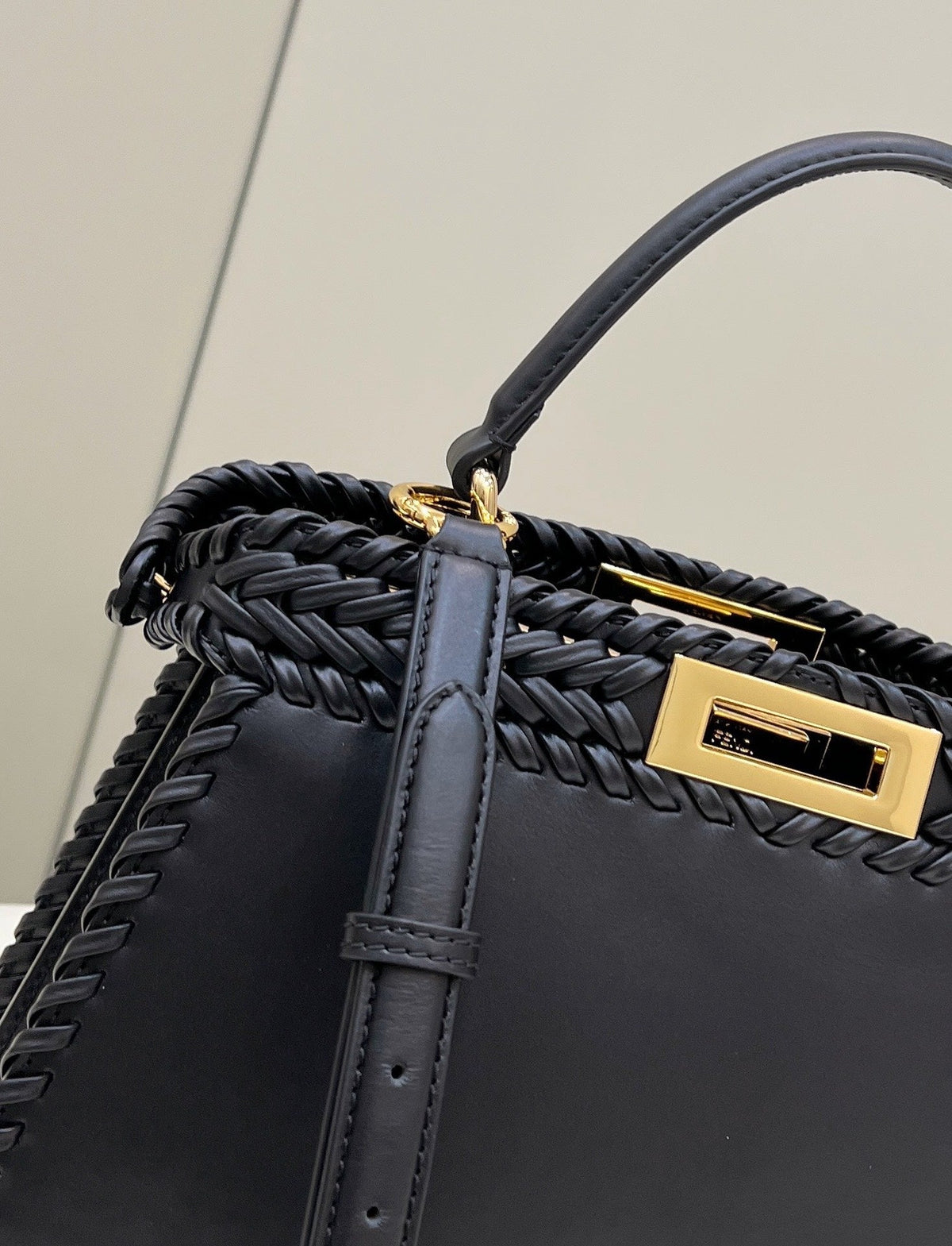 PEEKABOO ISEEU 27 IN BLACK SMOOTH CALFSKIN WITH WOVEN TRIM GOLD HARDWARE