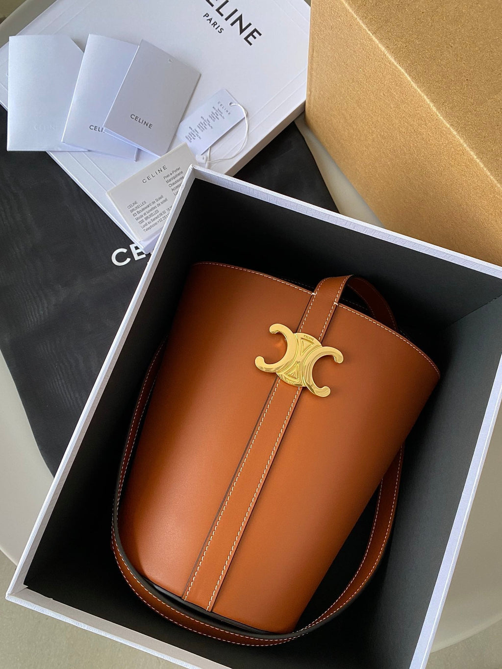 TRIOMPHE 25 BUCKET BAG CINNAMON BROWN CALFSKIN