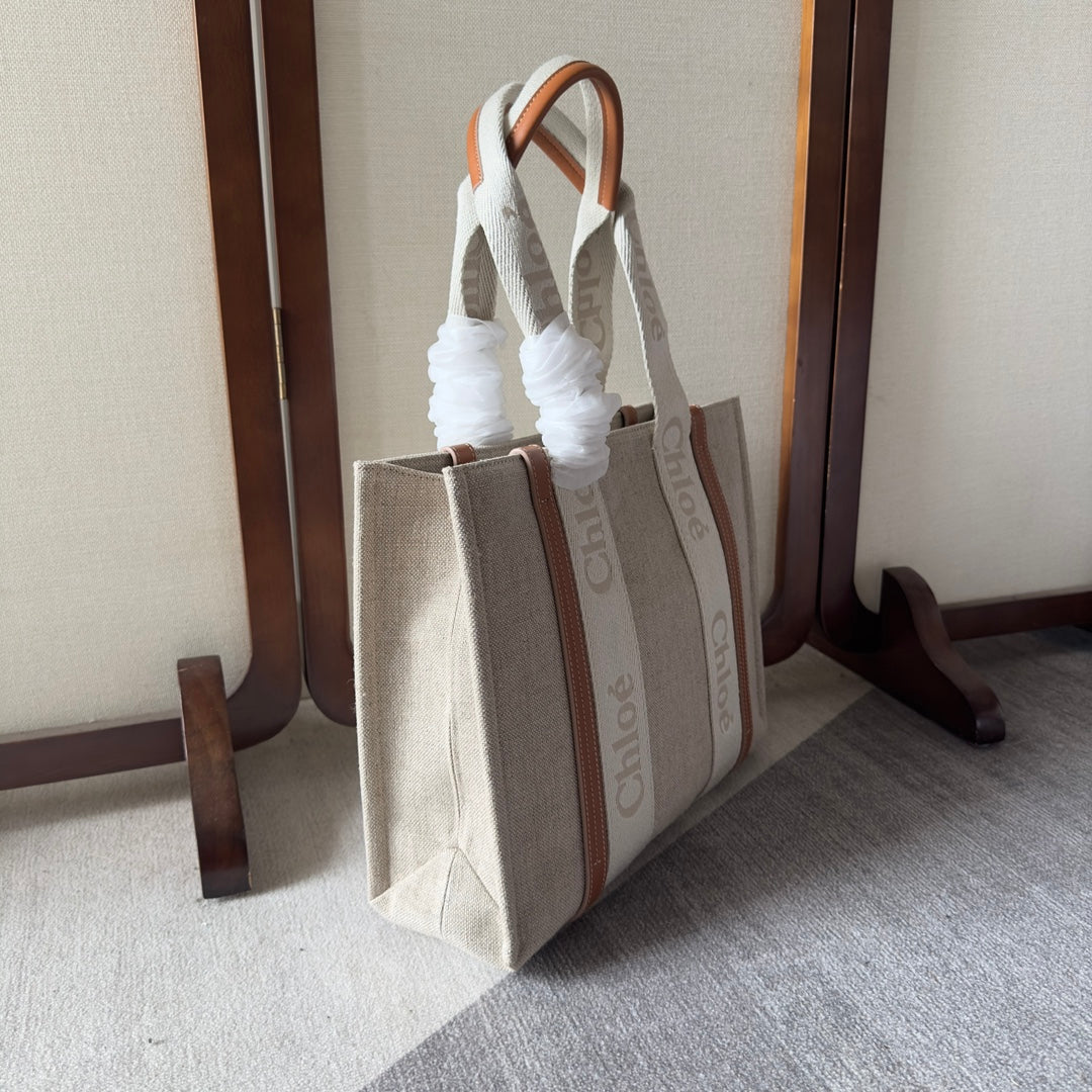 MEDIUM WOODY TOTE BAG 37 IN BEIGE LINEN CANVAS WEBBING LOGO EMBROIDERY BROWN CALFSKIN