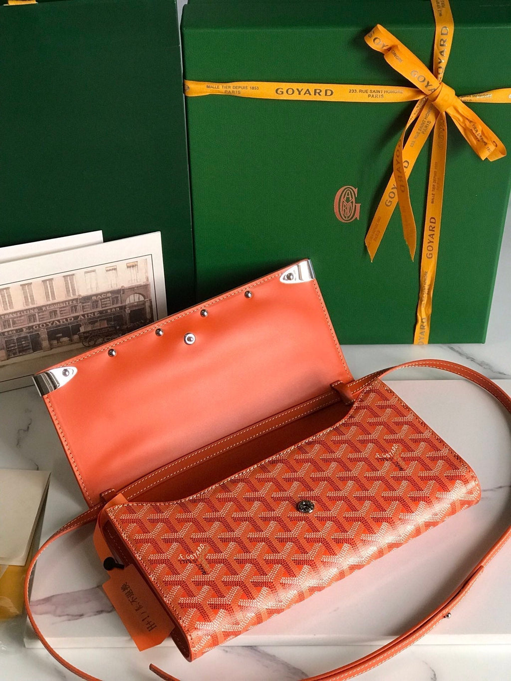 MONTE-CARLO PM CLUTCH 25 IN ORANGE GOYARDINE CANVAS