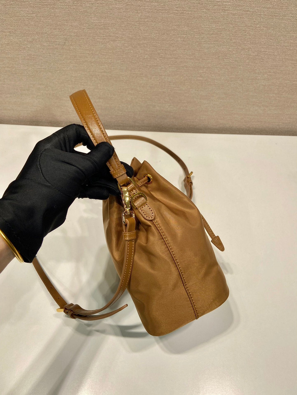 BUCKET BAG 19 IN RUSSET BROWN RE-NYLON AND CALFSKIN HANDLE
