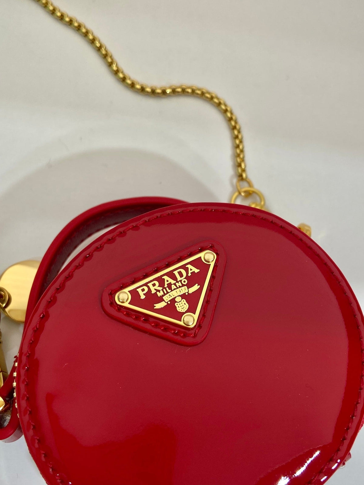 MINI ROUND BAG 8 IN RED GLOSSY CALFSKIN GOLD HARDWARE