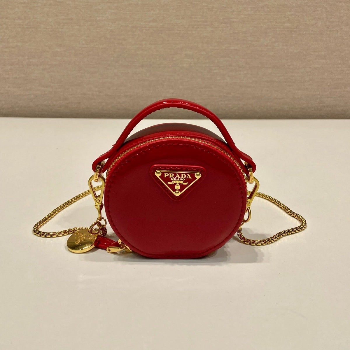 MINI ROUND BAG 8 IN RED GLOSSY CALFSKIN GOLD HARDWARE