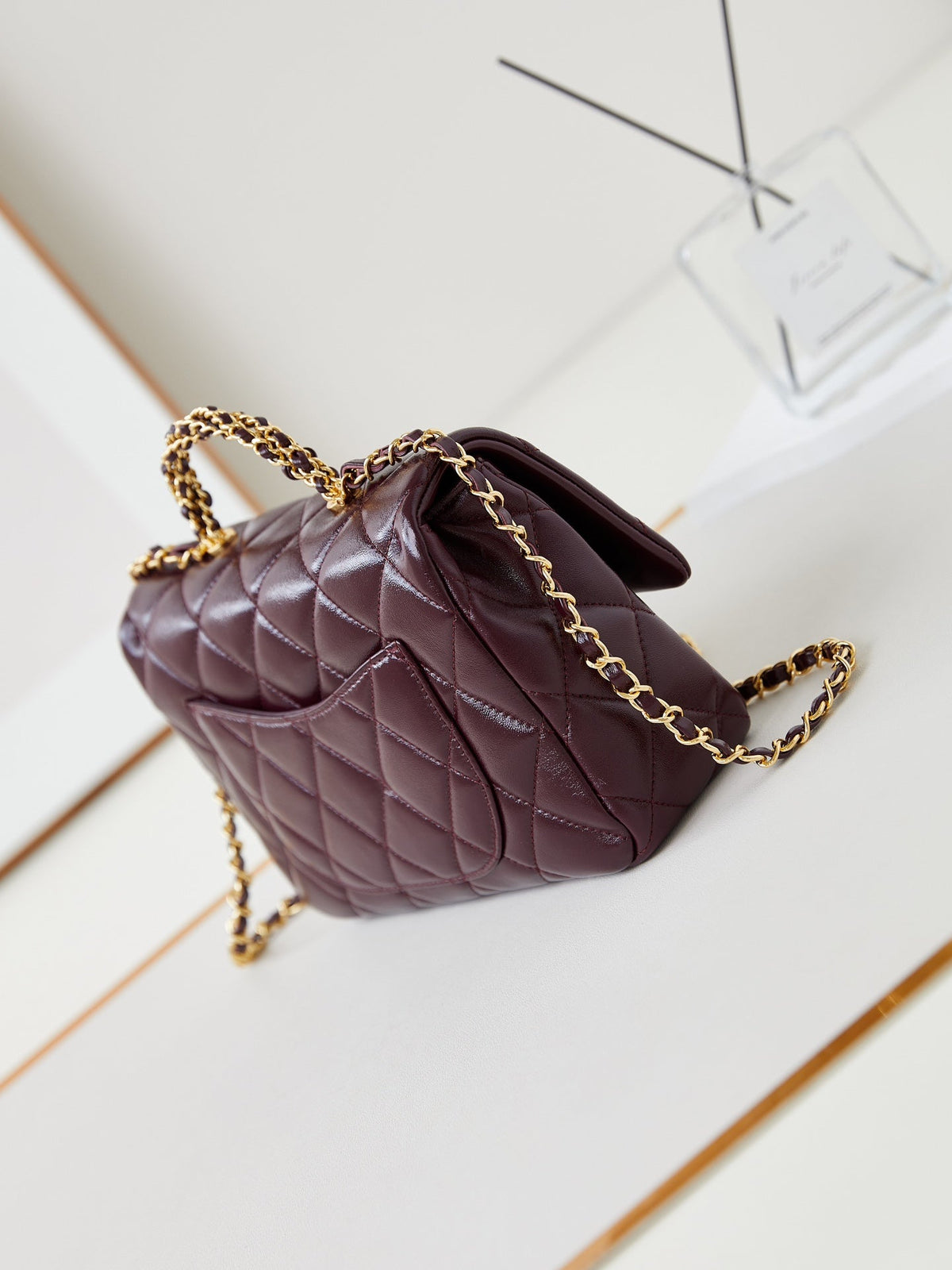 FLAP BAG WITH TOP HANDLE 25 IN WINE RED OIL-WAX LAMBSKIN GOLD HARDWARE