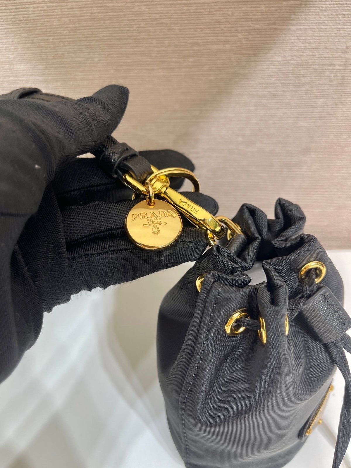 MINI BUCKET BAG 10 IN BLACK RE-NYLON AND SAFFIANO LEATHER STRAP