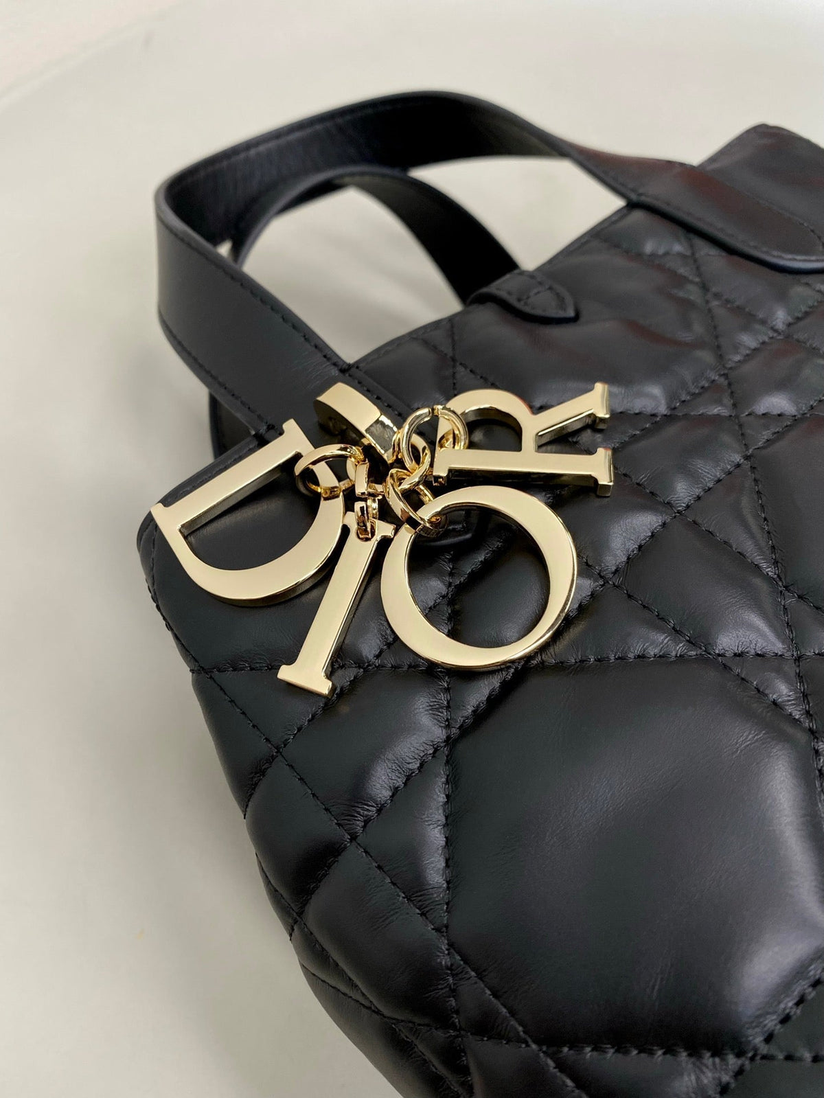 MINI TOUJOURS BUCKET BAG 18 IN BLACK CANNAGE CALFSKIN