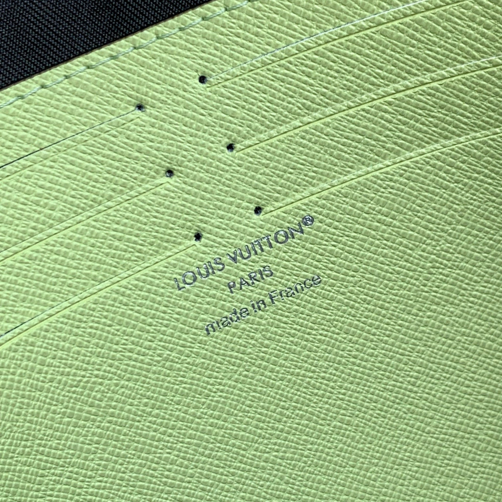POCHETTE VOYAGE 26 IN LEMON YELLOW MONOGRAM ECLIPSE CALFSKIN