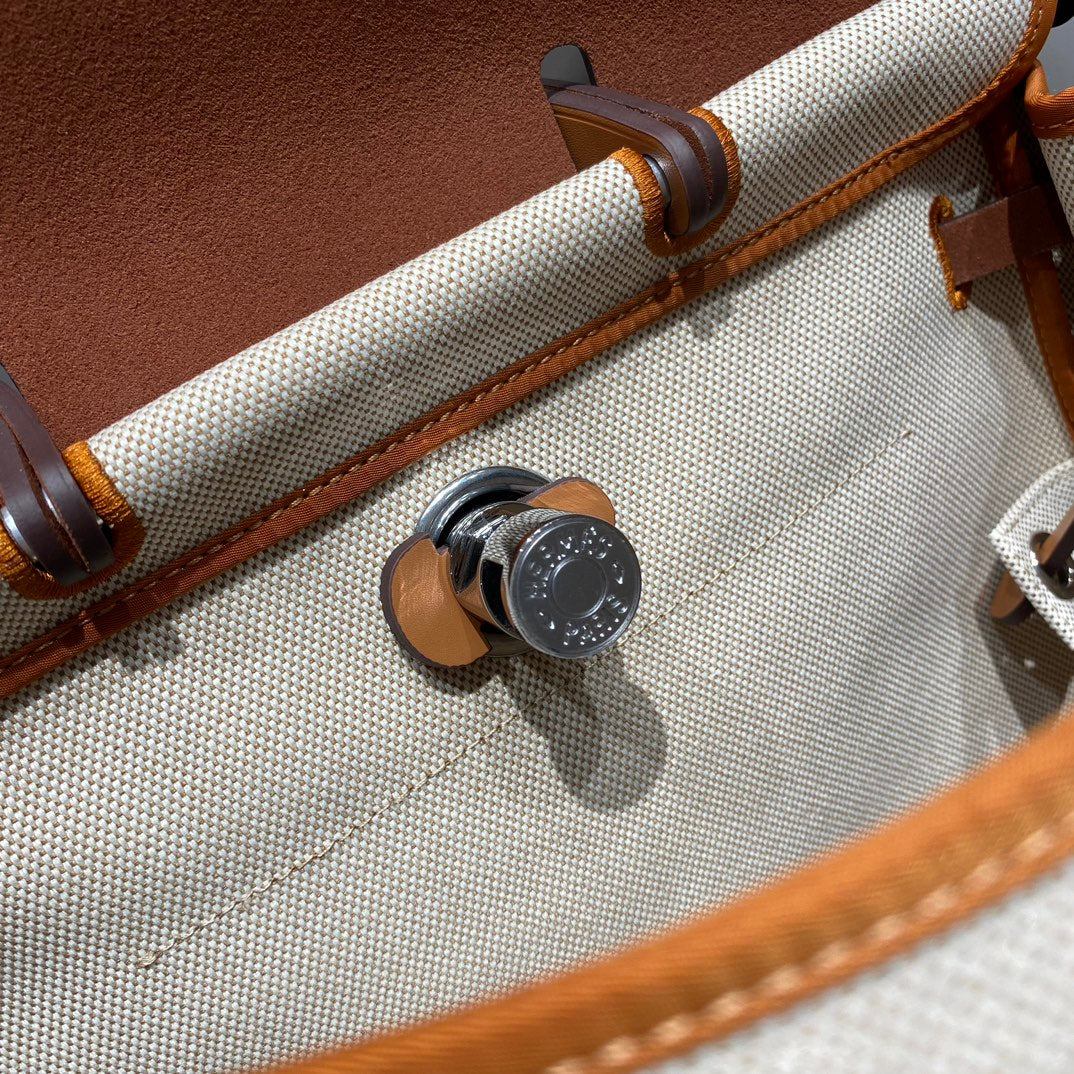 HERBAG A DOS ZIP RETOURNE BACKPACK 29 IN OFF-WHITE CANVAS AND BROWN CALFSKIN