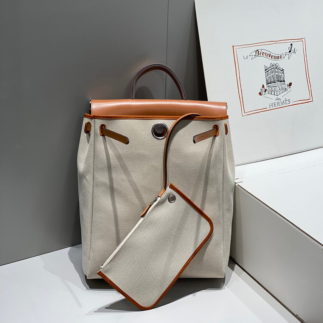 HERBAG A DOS ZIP RETOURNE BACKPACK 29 IN OFF-WHITE CANVAS AND BROWN CALFSKIN