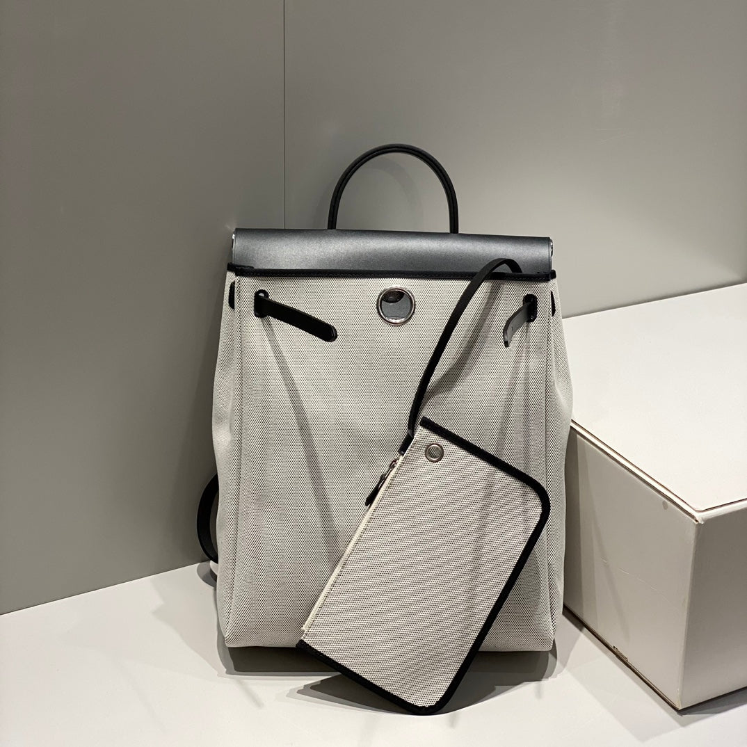 HERBAG A DOS ZIP RETOURNE BACKPACK 29 IN OFF-WHITE CANVAS AND BLACK CALFSKIN