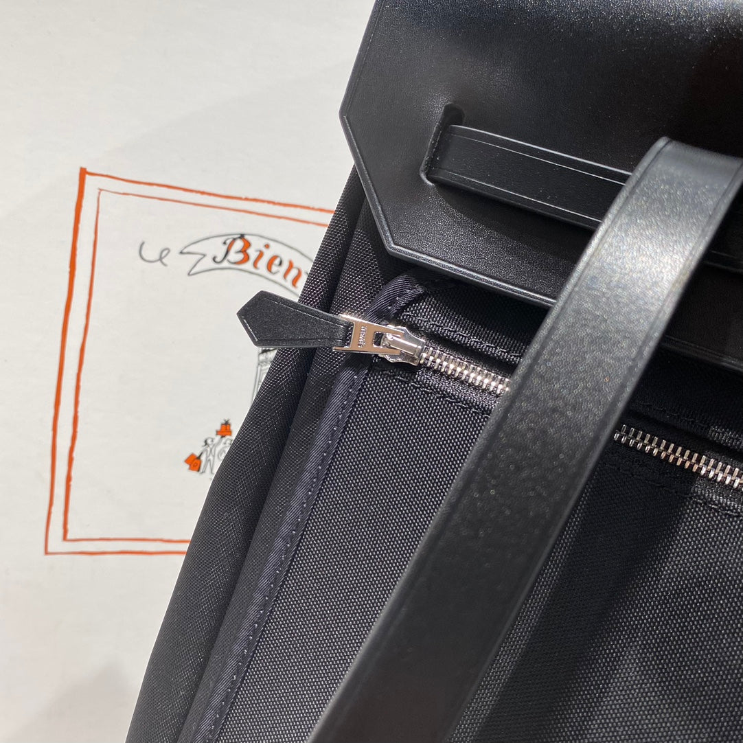 HERBAG A DOS ZIP RETOURNE BACKPACK 29 IN BLACK CANVAS AND CALFSKIN