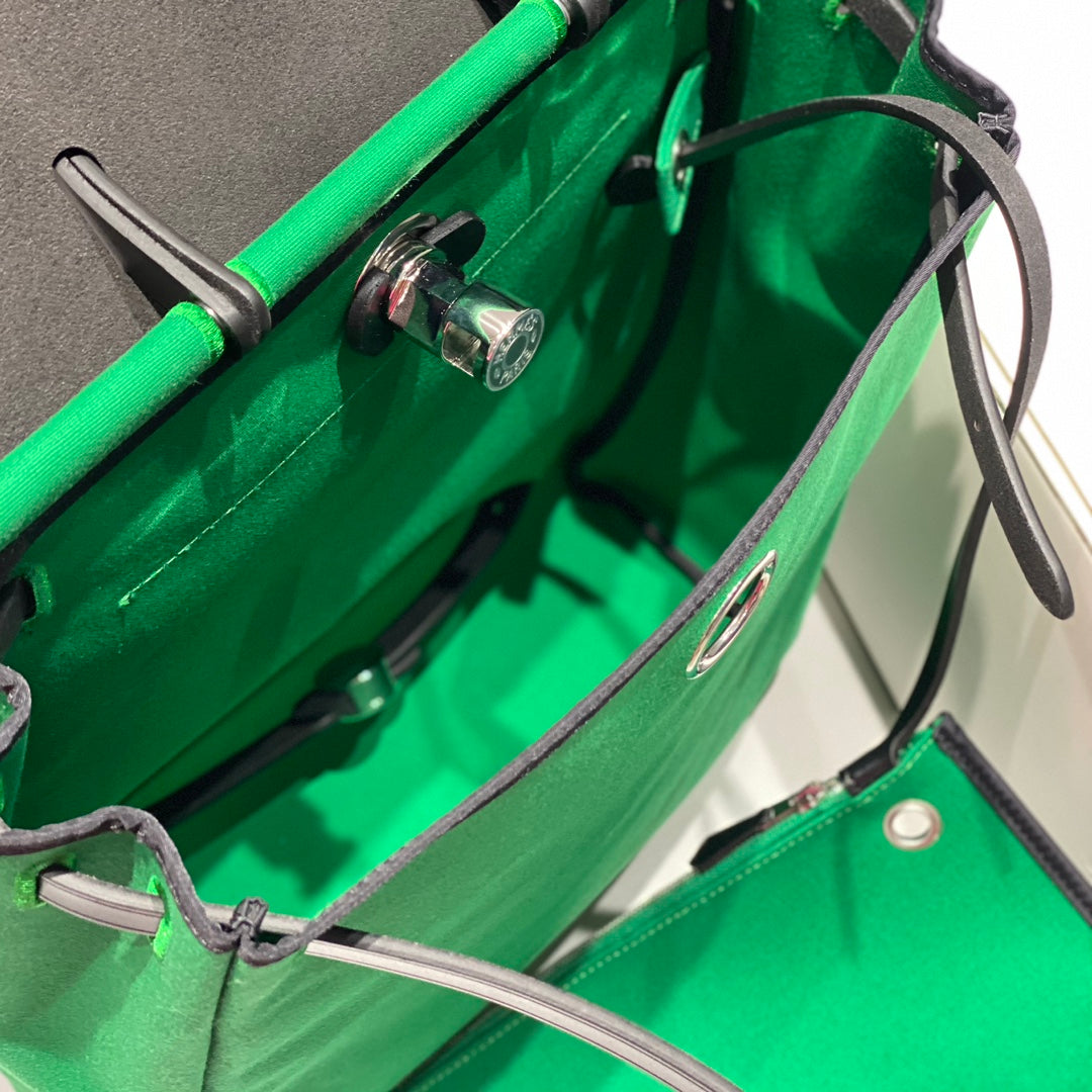 HERBAG A DOS ZIP RETOURNE BACKPACK 29 IN GREEN CANVAS AND BLACK CALFSKIN