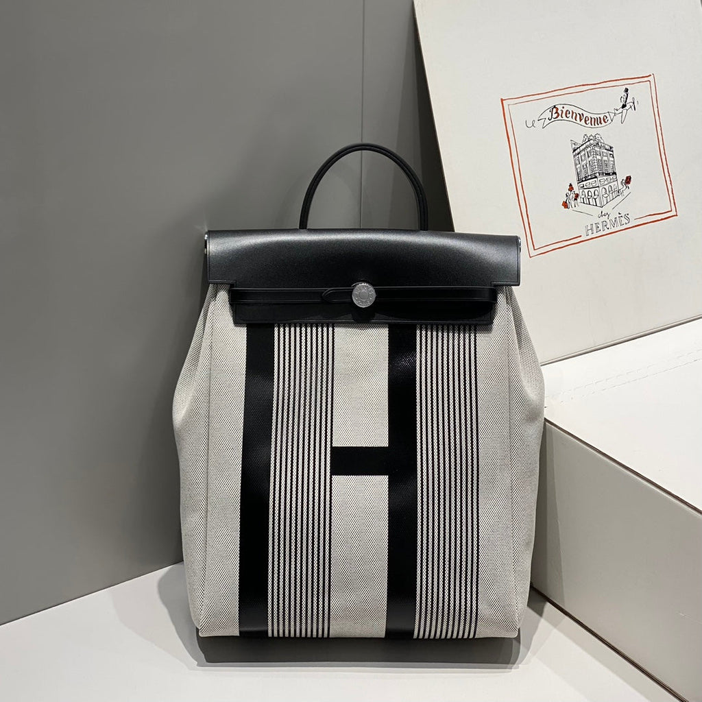 HERBAG A DOS ZIP RETOURNE BACKPACK 29 IN OFF-WHITE MIX BLACK CANVAS AND CALFSKIN
