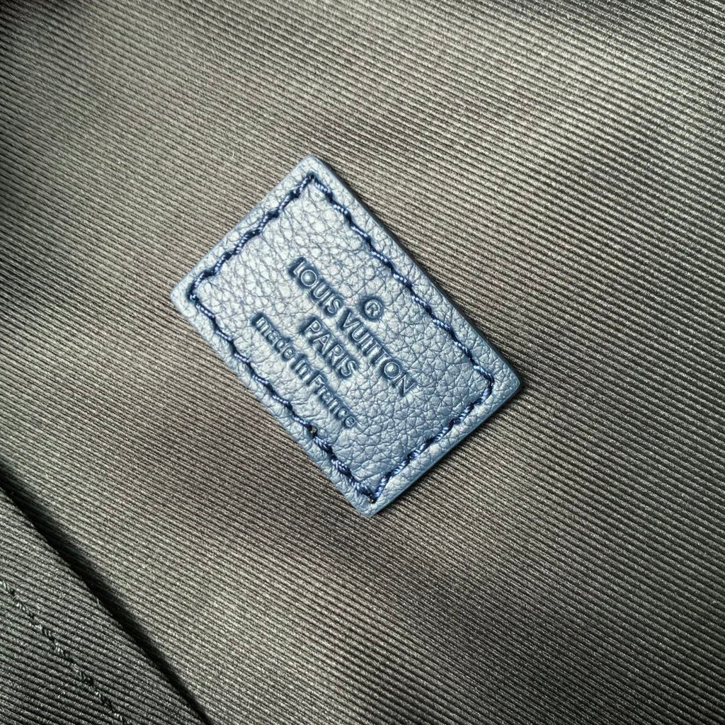 DISCOVERY PM BACKPACK 38 IN NAVY BLUE LAMBSKIN WHITE MONOGRAM LOGO