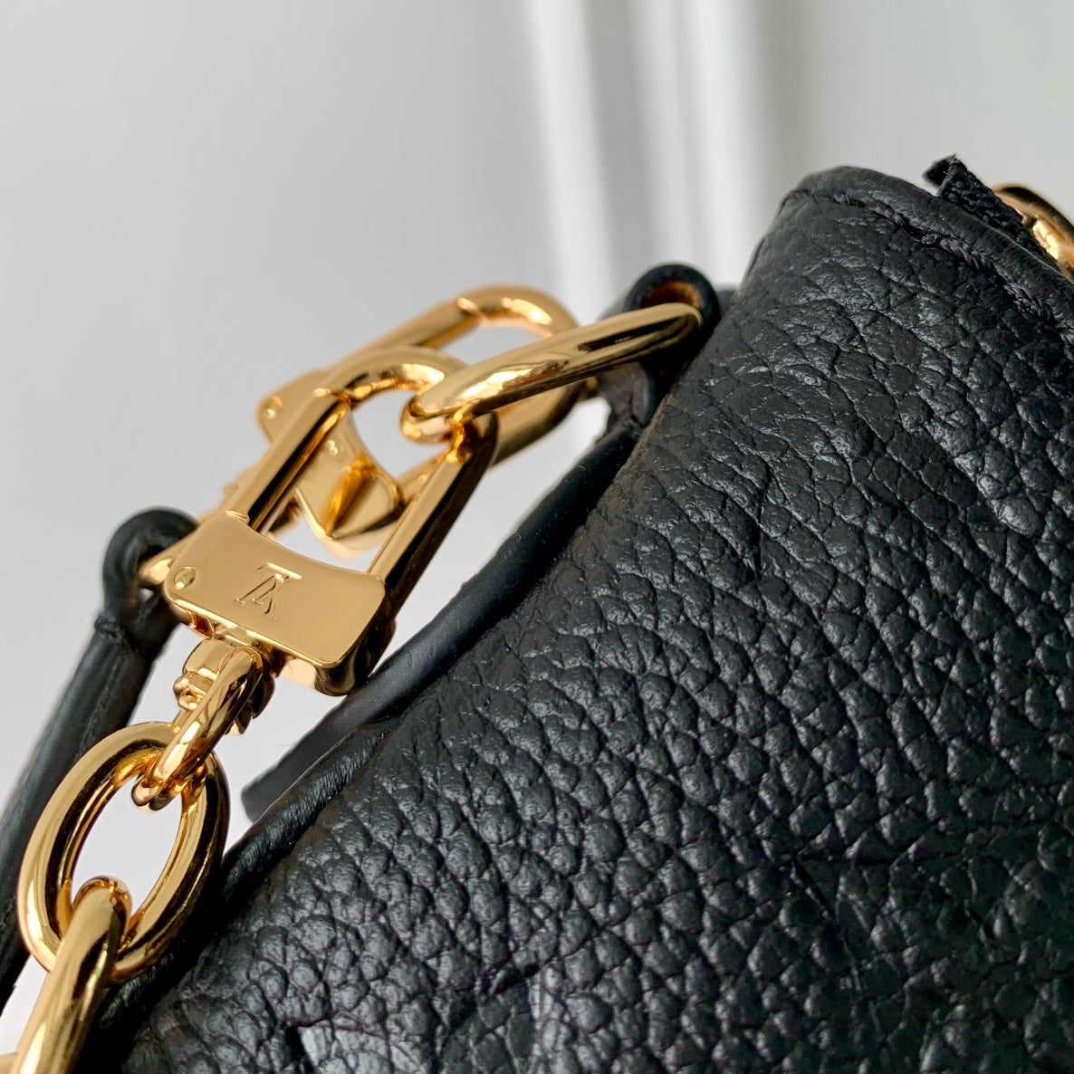 LIV POCHETTE BAG 24 IN BLACK MONOGRAM EMPREINTE LEATHER